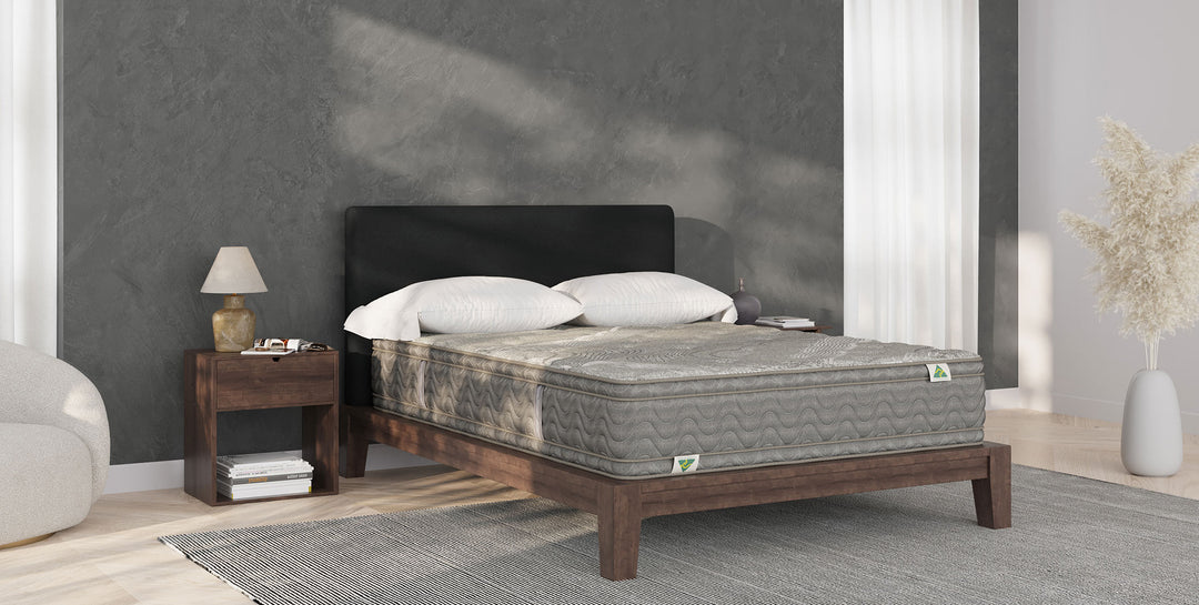Mattress Builders king-size mattress in a styled bedroom with upholstered bedhead