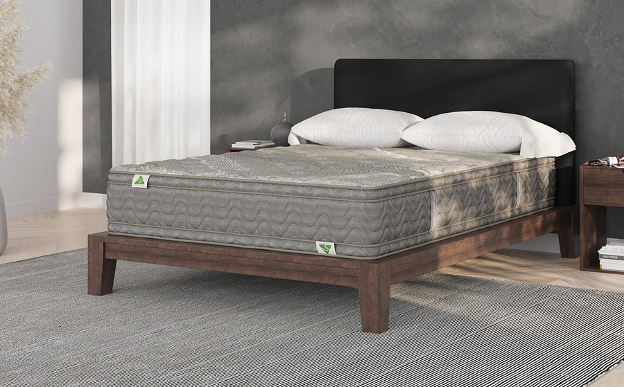 Mattress Builders king mattress on a timber bed frame in a styled bedroom